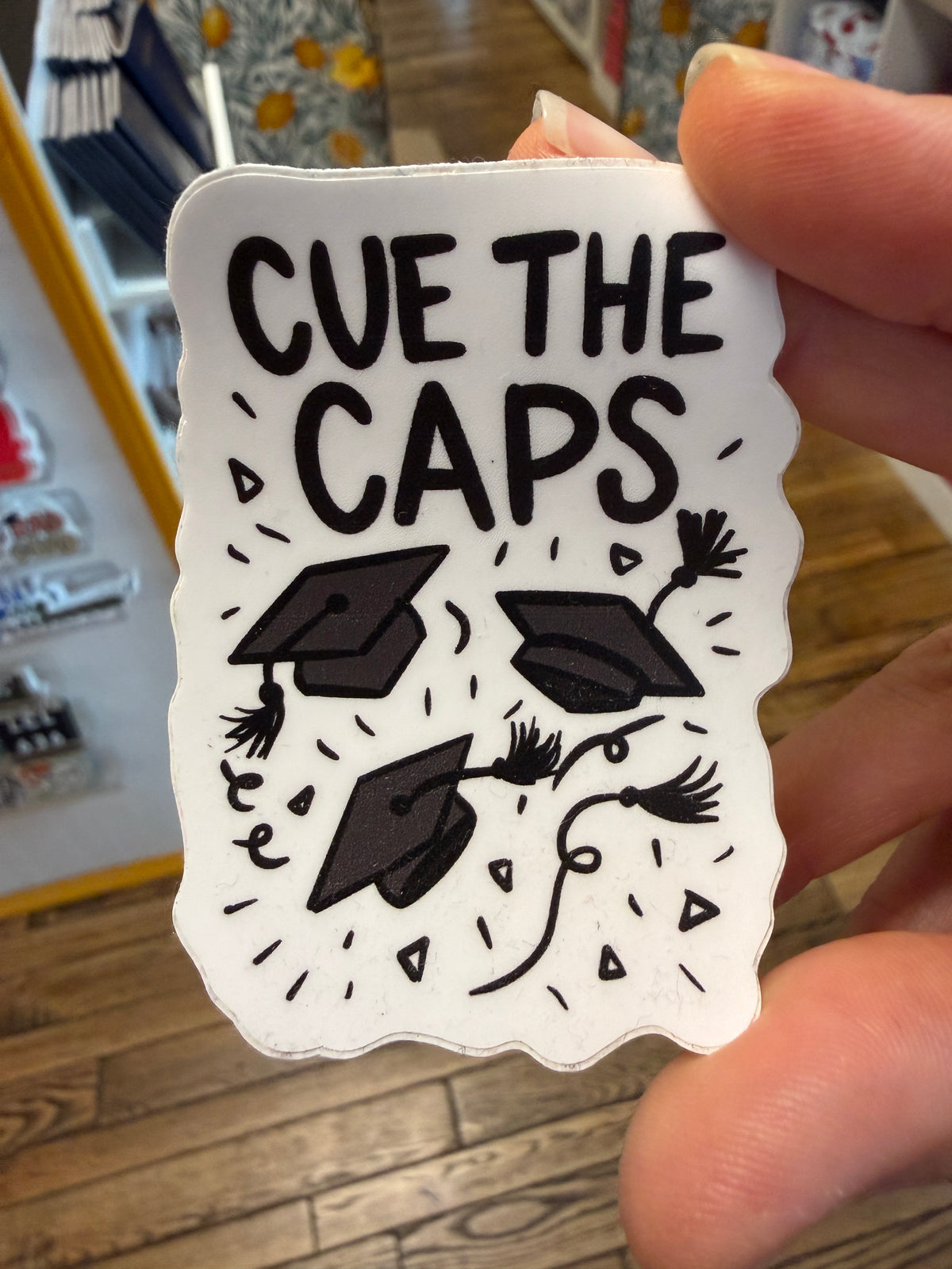 Cue the Caps Sticker
