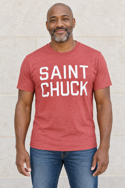 AI-generated front-view mockup of a man wearing the Heather Red SAINT CHUCK tee